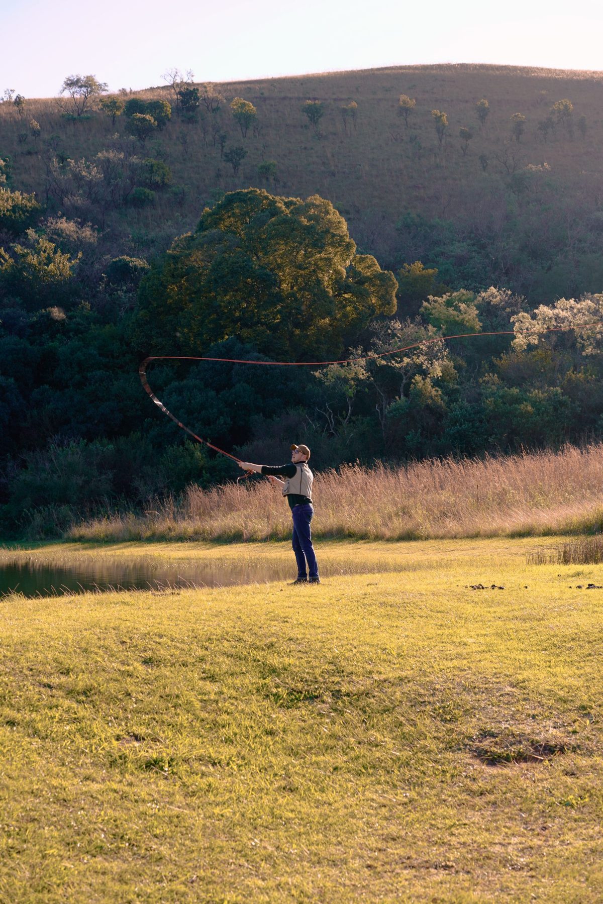 Lone figure in dullstroom landscape at sunset. Photo by Shaun Putter